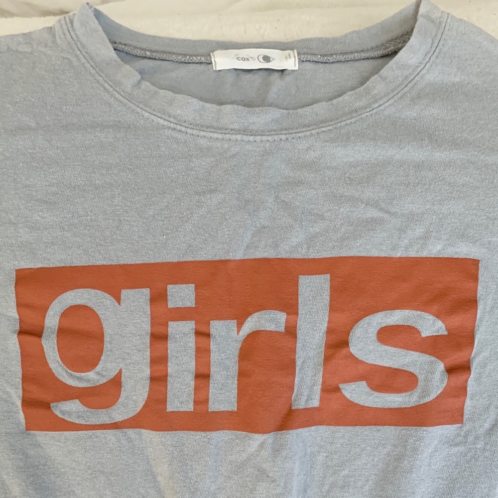 Feminist “girls” shirt in light blue with orange